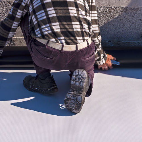 A Roofer Installing Single-Ply TPO.