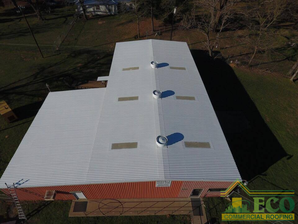 Newly restored commercial roof with enhanced weather resistance