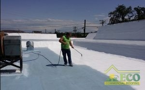 Roofer Applying a Roof Restoration